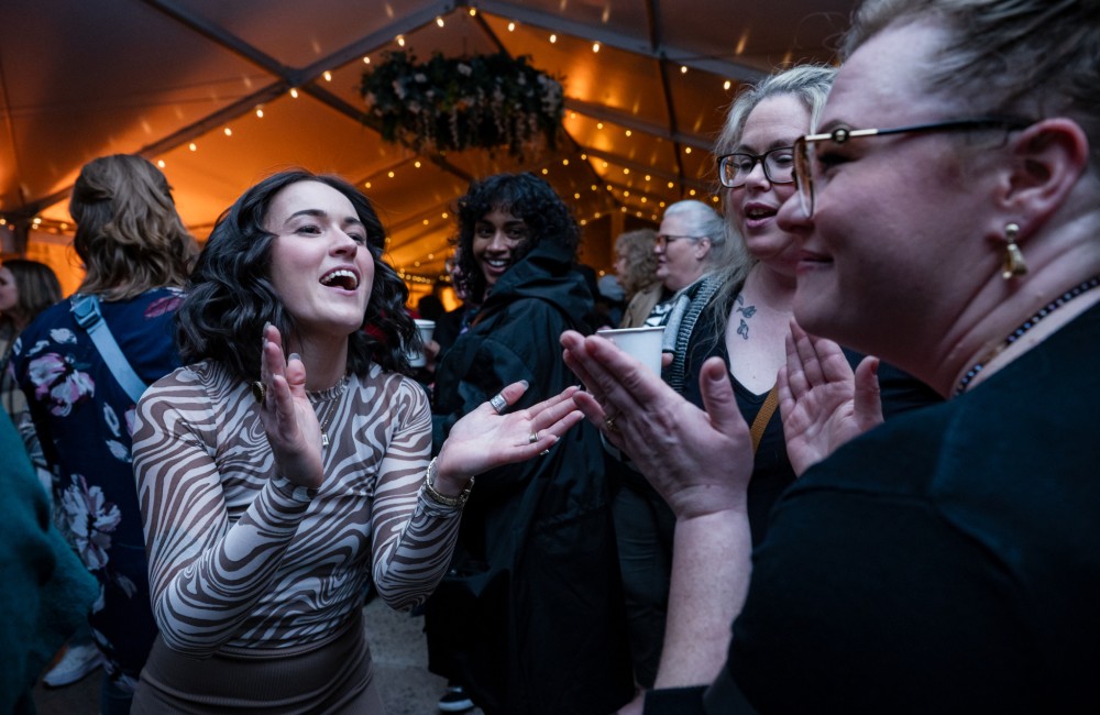 People clapping while dancing.