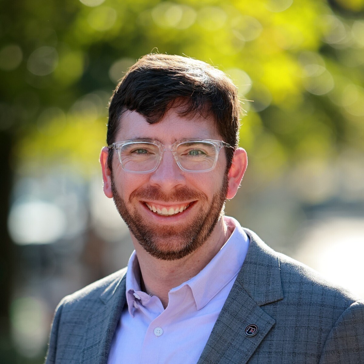 Headshot of man in glasses.