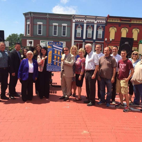 Milan Main Street leaders standing on Main Street with MSA staff.