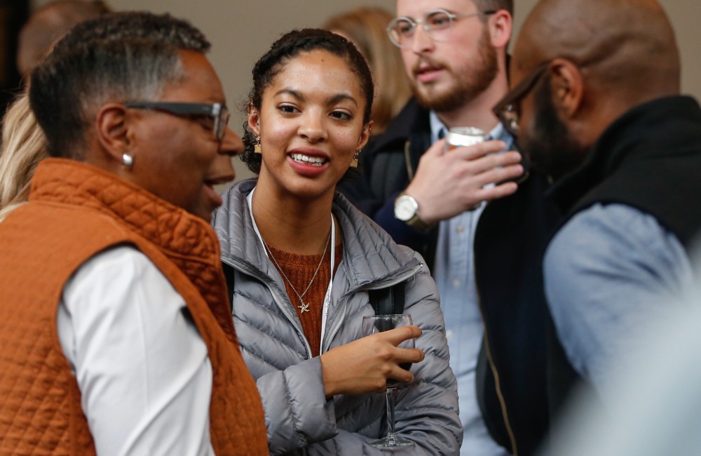 People chatting at a mixer.