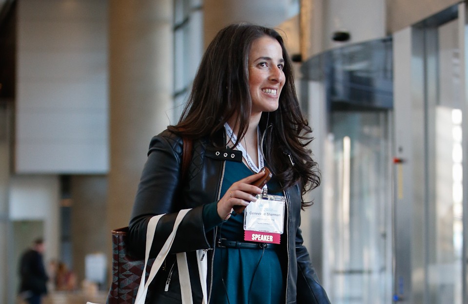 Woman walking with a suitcase.