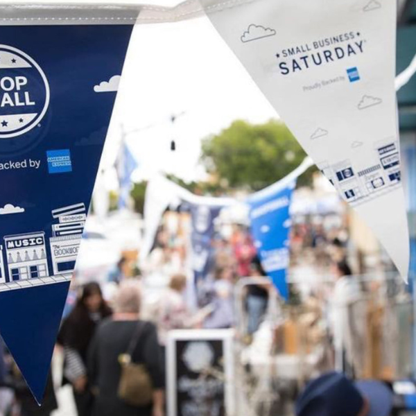 Shop Small flags wave in the wind in Oceanside, California.