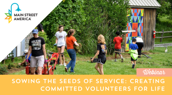 Graphic featuring a photo of adults and children participating in a green space clean-up event. In the upper left corner, the Main Street America logo is placed on top of a white triangle; along the bottom edge, white text on an orange background reads "Sowing the Seeds of Service: Creating Committed Volunteers for Life."