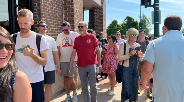 Main Street America staff walking down a sidewalk during a tour of a district